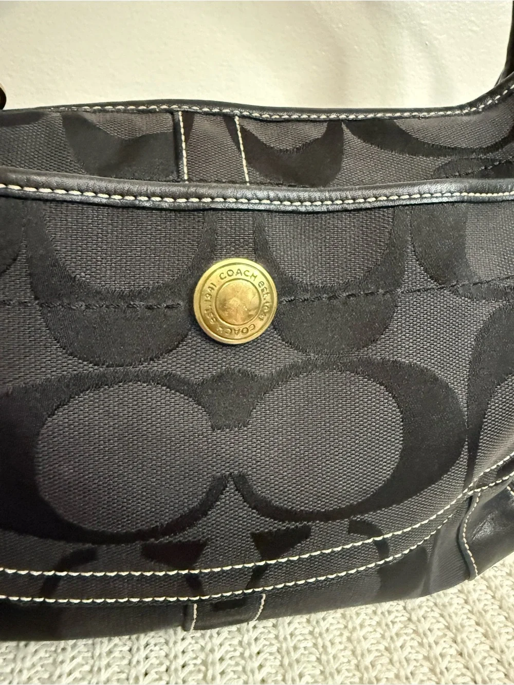 Coach Ergo Signature Jacquard Hobo bag featuring a black-on-black